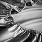 Seidiges, kühles Spannbettlaken aus synthetischem Satin