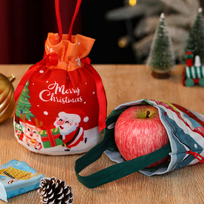 Jute-Weihnachtstasche mit Apfelband und Süßigkeiten